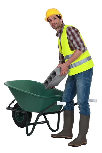 Builder with a wheelbarrow — Stok fotoğraf