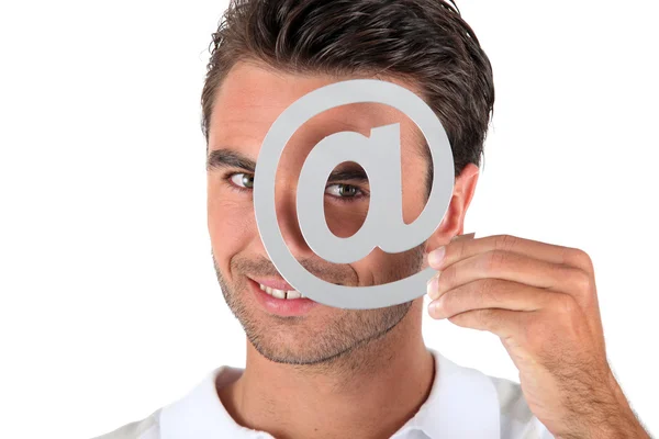 Hombre cubriendo el ojo con en símbolo — Foto de Stock