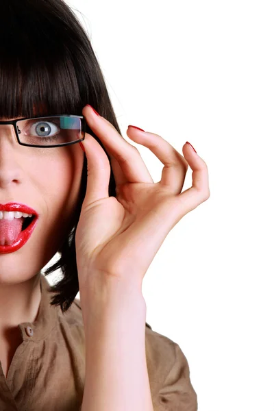 Femme avec des lunettes sortant de sa langue Image En Vente
