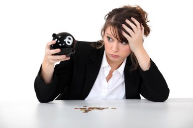 Young desperate woman with her piggy bank clipart