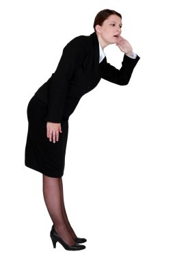 A hard hearing businesswoman. clipart