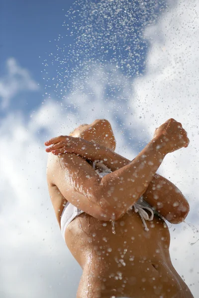 Woman splashing around in the sea — Stock Photo, Image