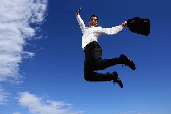Empresario con maletín saltando de alegría —  Fotos de Stock