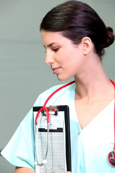 Nurse with a clipboard and stethoscope — Stock Photo, Image