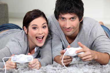 Couple playing computer games clipart