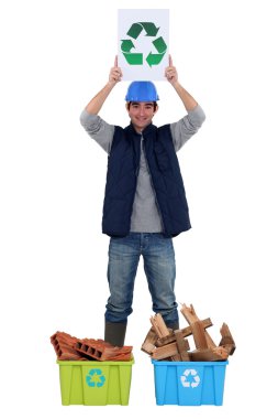 Young tradesman promoting recycling clipart