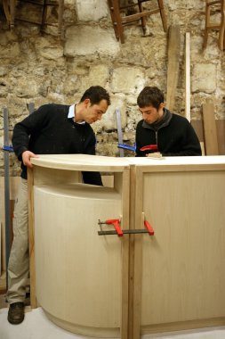Carpenters building a bar clipart