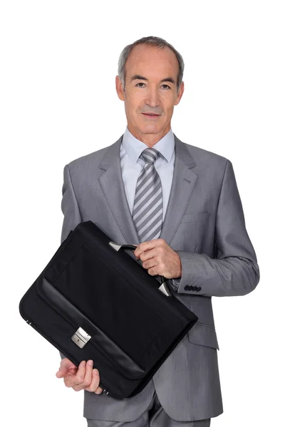 Elegante senior man op witte achtergrond — Stockfoto