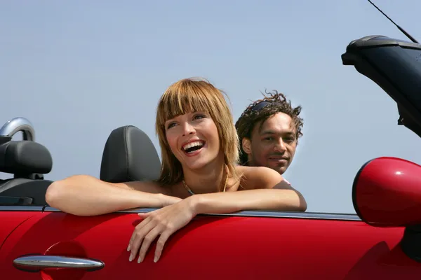 Woman riding in a convertible — Stock Photo, Image