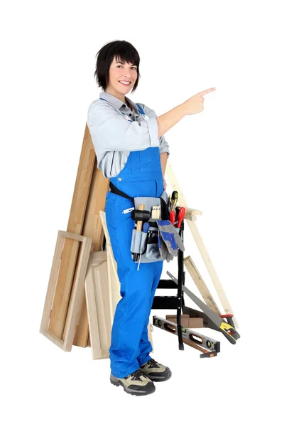 Smiling woman carpenter on white background — Stock Photo, Image