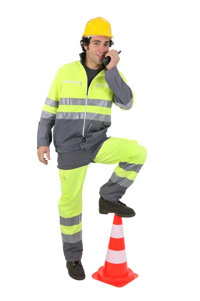 Construction worker with a walkie talkie — Stock Photo, Image