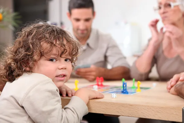 Family playing board games. — Stock Photo, Image