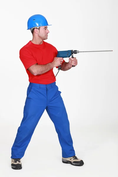 Man using large drill — Stock Photo, Image