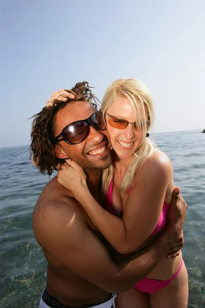 Cheerful couple in the sea — Stock Photo, Image