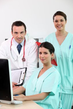 Doctor with his assistants clipart