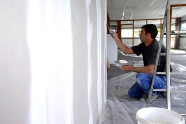 Man plastering a wall clipart