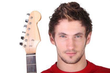 Determined man holding a guitar clipart