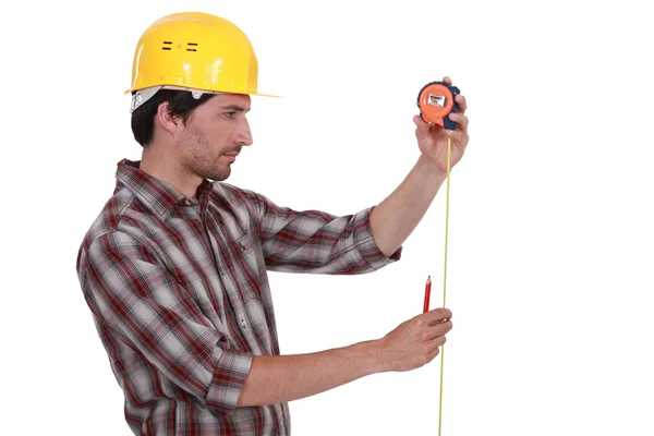 Worker with a tape measure — Stock Photo, Image