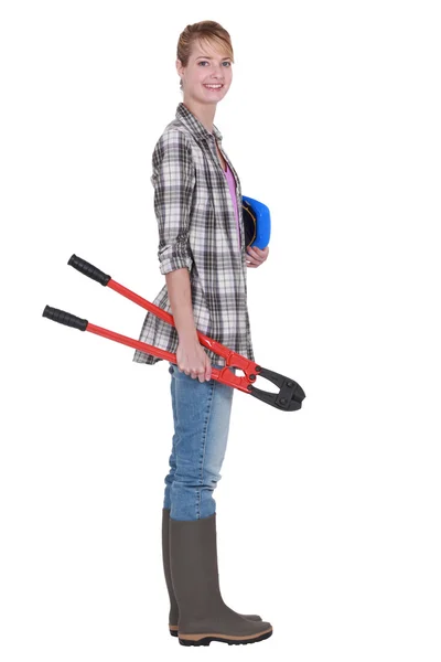 Woman carrying bolt cutters — Stock Photo, Image