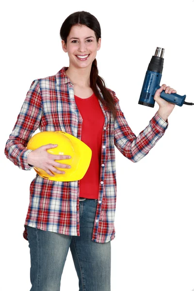 Mujer sosteniendo un destornillador eléctrico —  Fotos de Stock