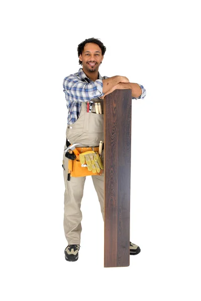 Workman standing with flooring — Stock Photo, Image