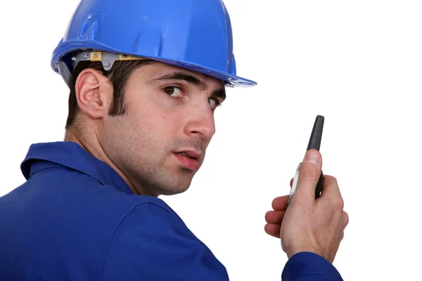 Builder using a walky talky — Stock Photo, Image