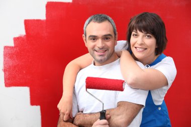 Couple painting room in red clipart