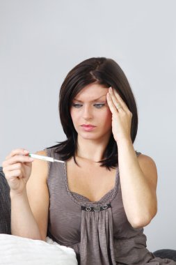 Woman with results to pregnancy test clipart