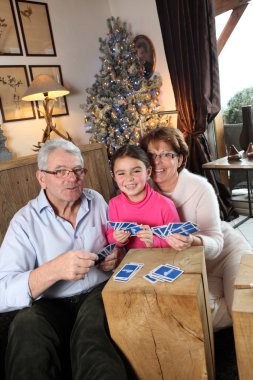 Grandparents playing game with little girl clipart