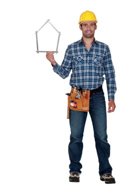 Man holding house-shaped measuring device clipart