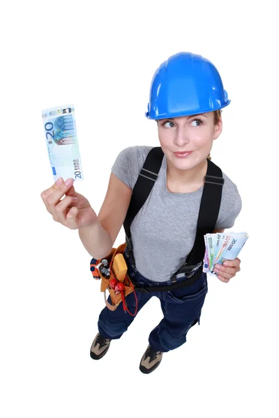 Female electrician counting money — Stock Photo, Image