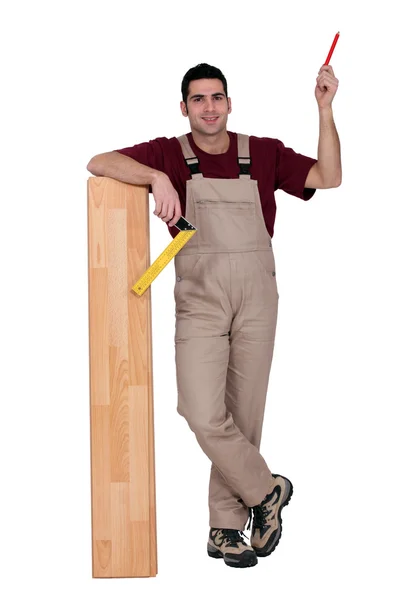 Worker with wooden flooring — Stock Photo, Image