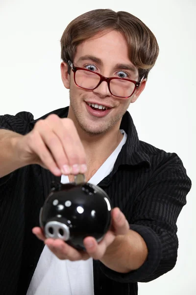 Geeky man saving money — Stock Photo, Image