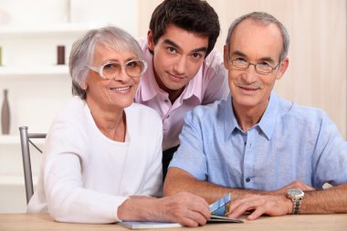 Grandson posing with his grandparents clipart