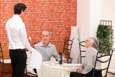 Seniors in a restaurant clipart