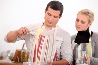 Couple making a recipe clipart