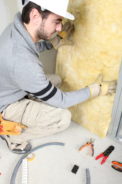 Man installing insulation — Stock Photo, Image