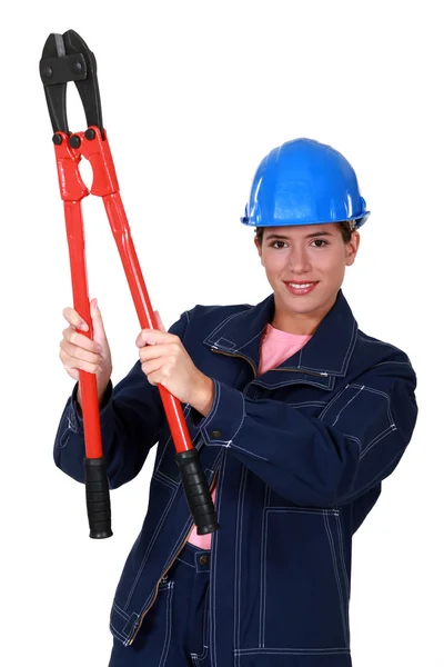 Mujer constructora sosteniendo pinzas —  Fotos de Stock