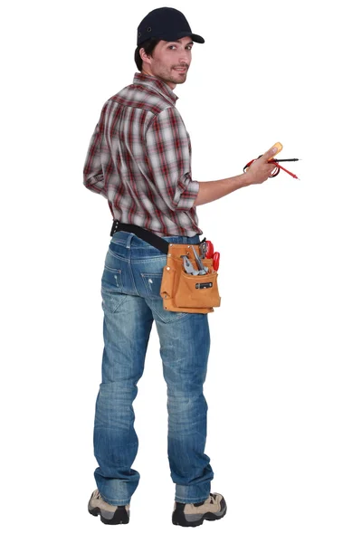 Rear view of an electrician — Stock Photo, Image