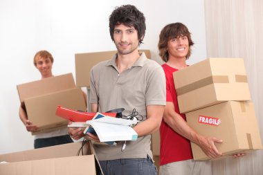 House mates carrying boxes clipart