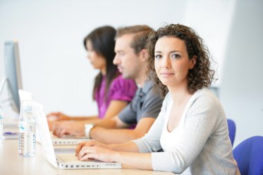 Three office workers sat in a row clipart