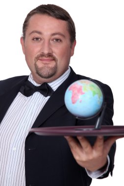 Elegant man with globe on a tray clipart