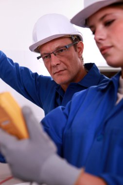 Male and female blue workers clipart