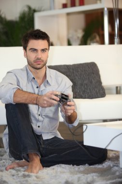 Man playing on console clipart