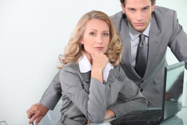 Executives with laptop computer clipart