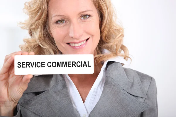 Vrouw met commerciële dienst teken — Stockfoto
