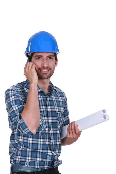Craftsman talking on his cell — Stock Photo, Image