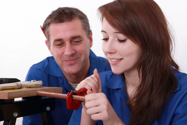 Young apprentice plumber with mentor — Stock Photo, Image