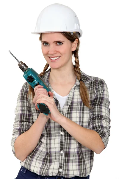 Tradeswoman in possesso di un attrezzo elettrico — Foto Stock