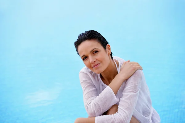 Woman near a swimming pool — Stock Photo, Image
